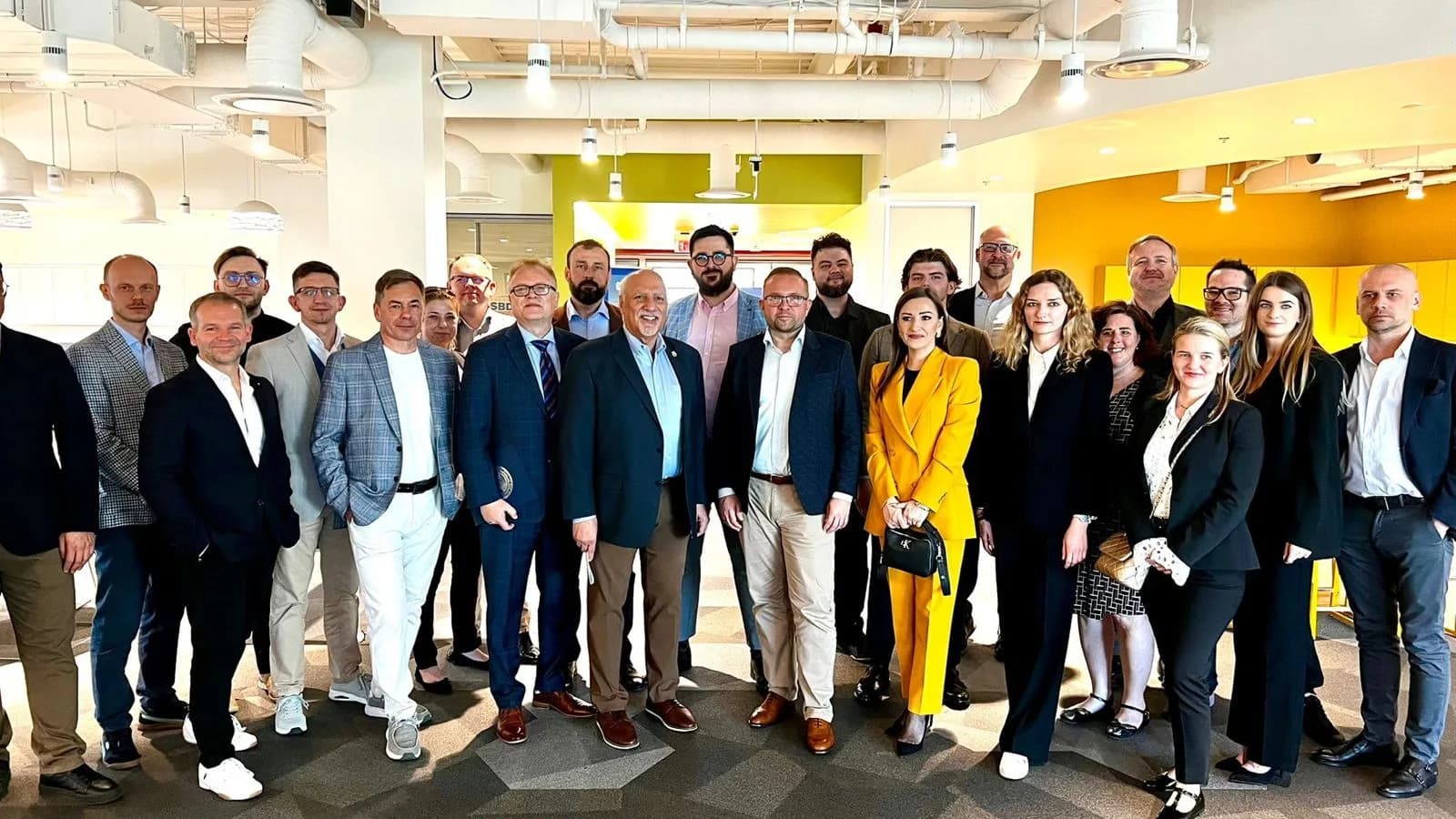 Members of the VisionariesNV community and team together at an event hosted in a U.S. innovation and small-business centre